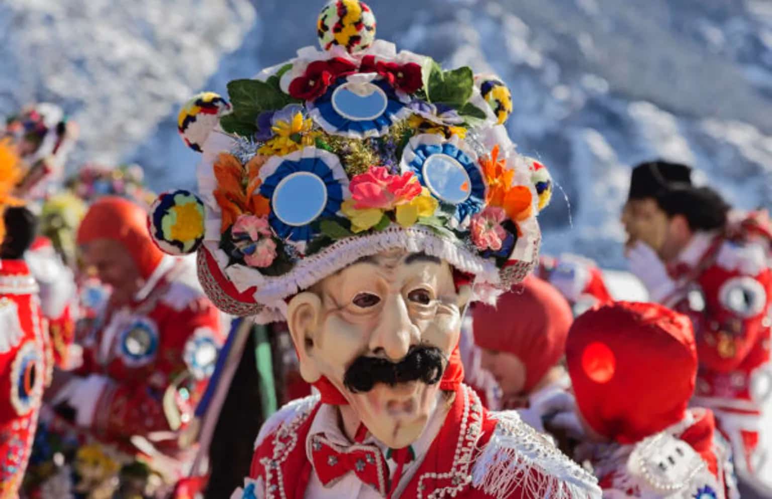 Carved masks and costumes of an Alpine carnival